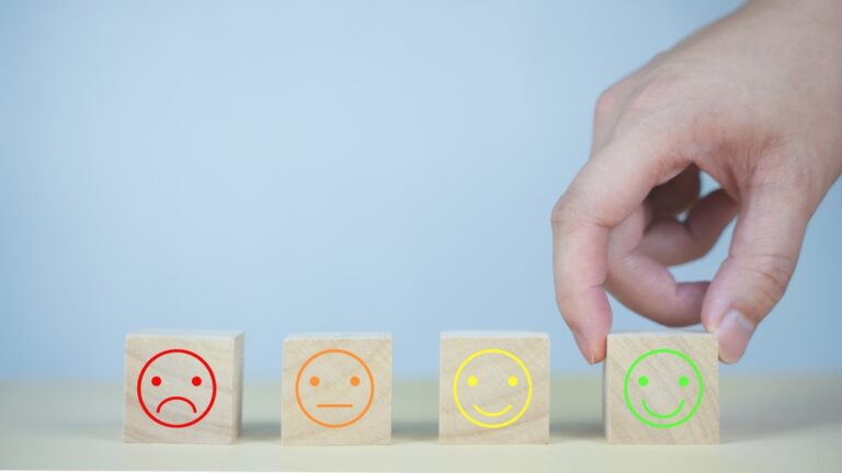 Wooden,Cubes,With,Different,Emoji,Faces,Ranging,From,Sad,To