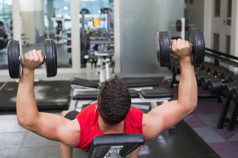 Male,Weightlifter,In,Red,Sportswear,Pressing,Dumbbells,On,Incline,Bench